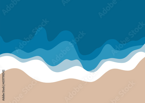 The blue sea has waves hitting the sandy beach.