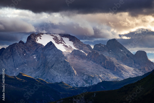 Marmolada Peak - 3343meters, the highest mountain in the Dolomites, Italy, with dramatic sky and fog photo