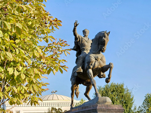 Statue of Tamerlane and Palace of Forums in center of Tashkent at sunset, Uzbekistan photo