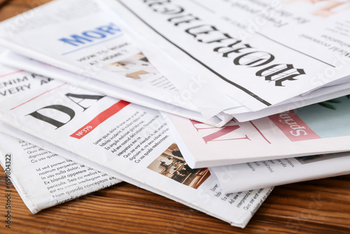 Morning newspapers on wooden background