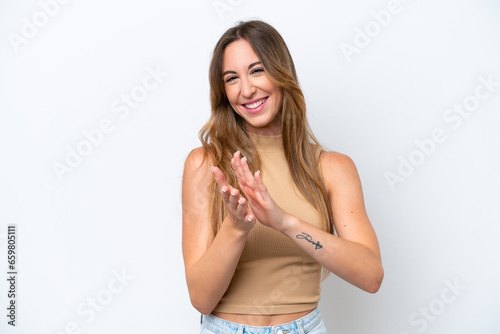 Young caucasian woman isolated on white background applauding after presentation in a conference © luismolinero