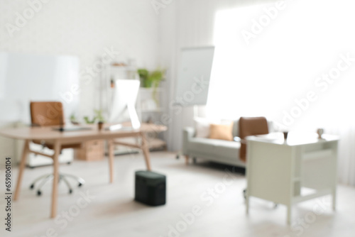 Blurred view of office with workplaces