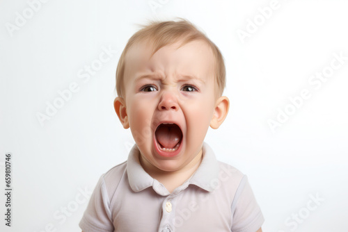 a closeup photo of a cute little baby child crying and screaming isolated on white background