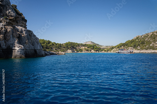 Stunning Anthony Quinn Bay Beach and Rock Formations of Rhodes  A sea-level panoramic view of the island s diverse coastline  showcasing sandy retreats and towering cliffs  epitomizing Grecian beauty.