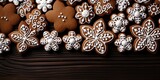 Christmas food bakery bake baking photography background - Closeup of many gingerbread cookies, with white icing decoration on dark wooden table, top view