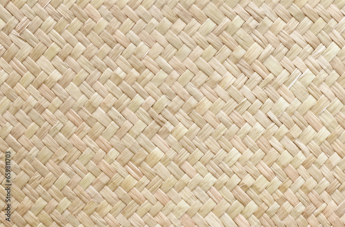 Pattern of old reed weaving mat with vintage style for background and design art work.