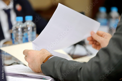 close up of a businessman holding a document