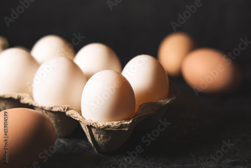 Still life image of eggs in cardboard egg cartons photo