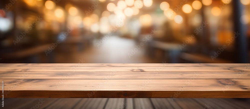 Empty wooden board on table in front of blurred background Brown wood perspective for display of product Empty wooden board on table in front of blurred background Brown wood perspective for display of product