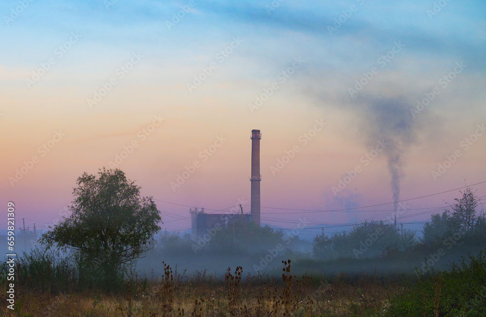 The furnace of the thermal plant, smoke and fog. Sinister decoration with the furnace of a coal-fired power station. The furnace of the thermal plant, smoke and fog. Sinister decoration with the furnace of a coal-fired power station.