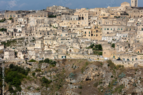 Panoramic view of Sassi di Matera a historic district in the city of Matera, well-known for their ancient cave dwellings from the Belvedere di Murgia Timone, Basilicata, Italy