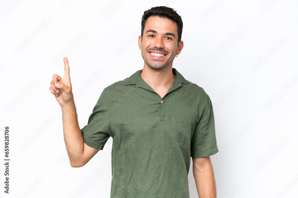 Young handsome man over isolated white background showing and lifting a finger in sign of the best Young handsome man over isolated white background showing and lifting a finger in sign of the best