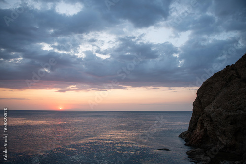 Sunset by the sea. Sunset long exposure. Sunset from the beach. Sea cliffs and sunset. Galippoli, Canakkale, Türkiye.