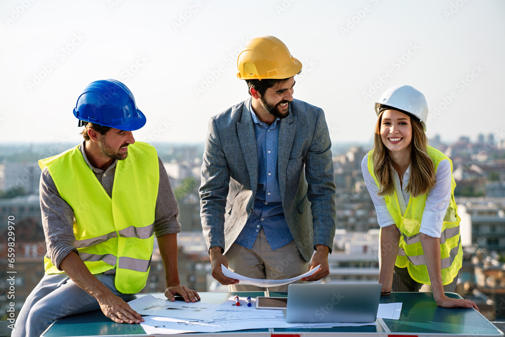Business, teamwork and people concept. Group of engineers and architects on construction site Business, teamwork and people concept. Group of engineers and architects on construction site
