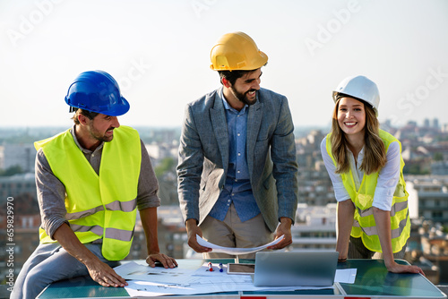 Business  teamwork and people concept. Group of engineers and architects on construction site