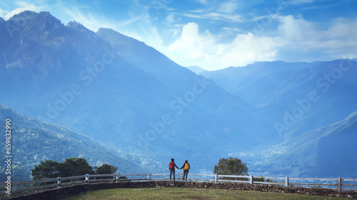 Couples travel nature at sheep farm at Doi Pha Tang, Doi Inthanon National Park, Chom Thong, Chiang Mai, Thailand