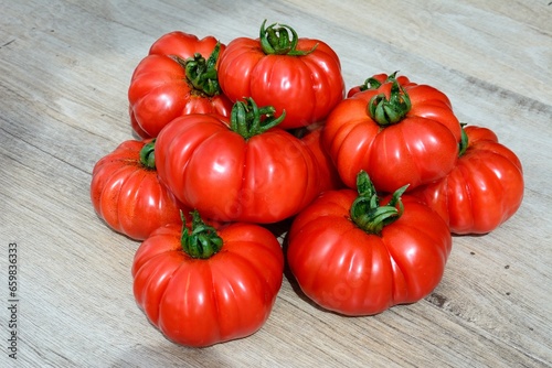 Harvested ripe Costoluto Fiorentino tomatoes in a pile, UK, Europe.