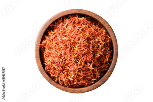 Dried safflower in wooden bowl, Top view photo