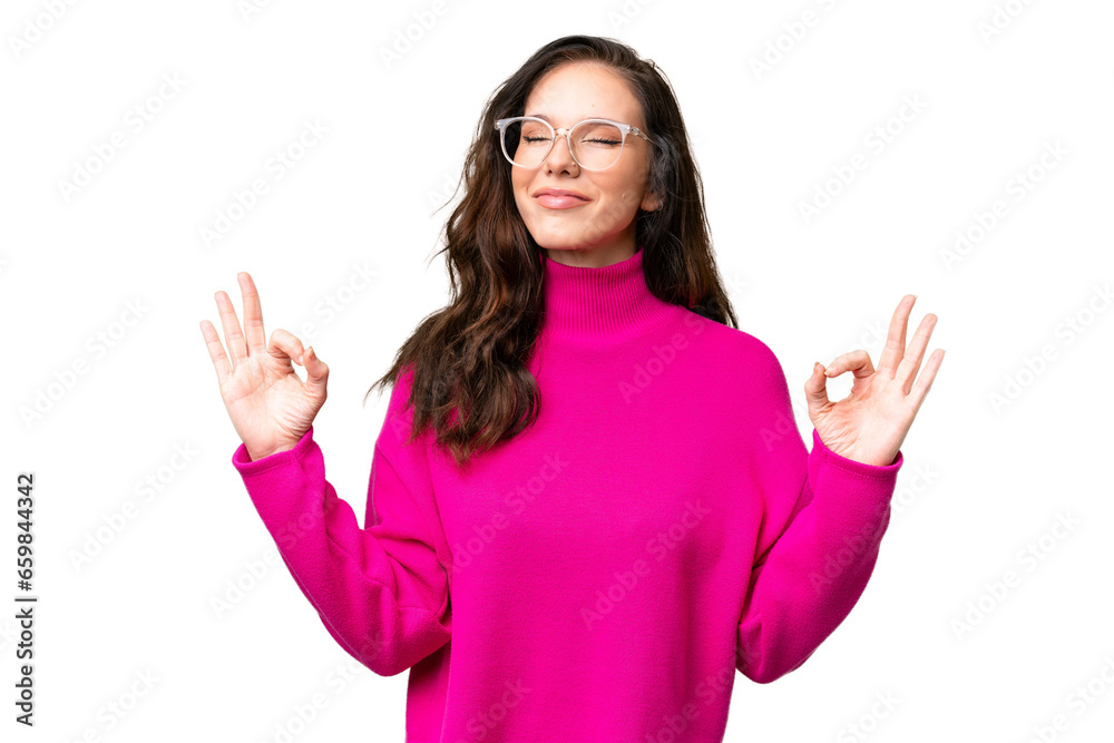 Young caucasian woman isolated over isolated background in zen pose Young caucasian woman isolated over isolated background in zen pose