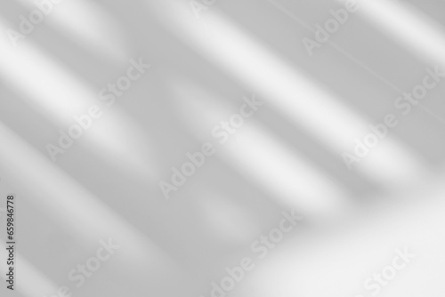 Abstract light reflection and grey shadow from window on white wall background. Gray stripe window shadows and sunshine diagonal geometric overlay effect for backdrop and mockup design photo