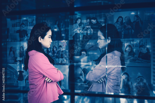 Sad introvert lonely female teenager looking at window