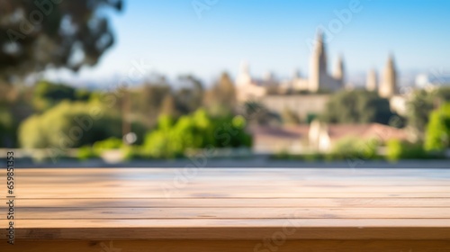 The empty wooden table top with blur background of the downtown business district. © Kowit