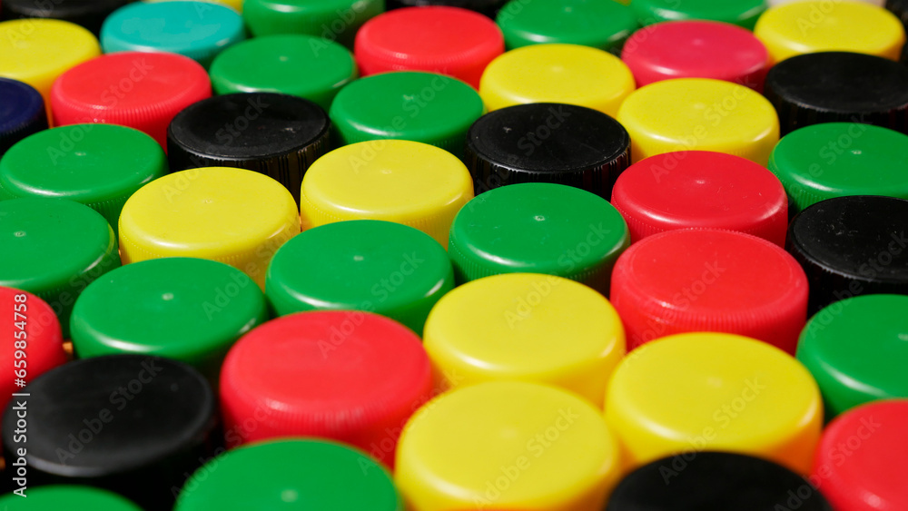 lots of plastic bottle caps. Environmental issues lots of plastic bottle caps. Environmental issues