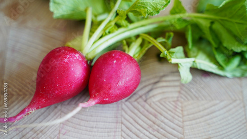 a bunch of radishes on a wooden table
