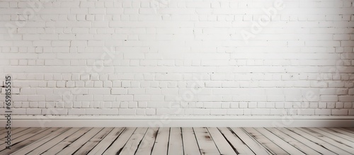 Empty room with white brick wall and wooden floor