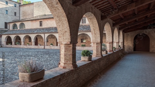 View of the cloister of ancient abbey in the Marche region, Italy