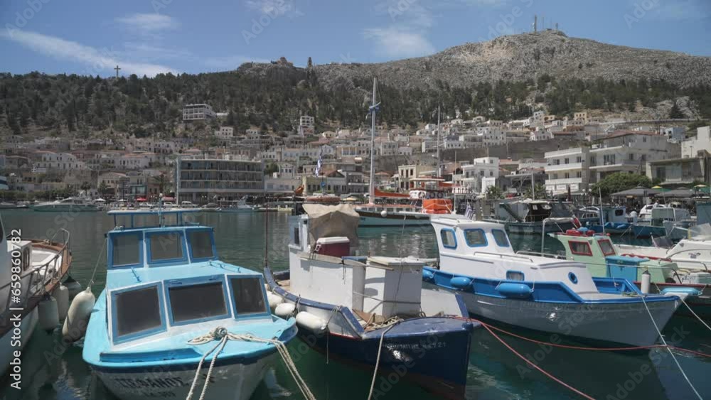 Boats in Kalimnos harbour and town in background, Kalimnos Town, Kalimnos, Dodecanese, Greek Islands Boats in Kalimnos harbour and town in background, Kalimnos Town, Kalimnos, Dodecanese, Greek Islands