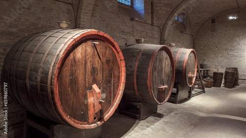 Wine barrels in a historic cellar in central Italy