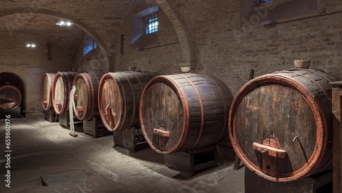 Wine barrels in a historic cellar in central Italy