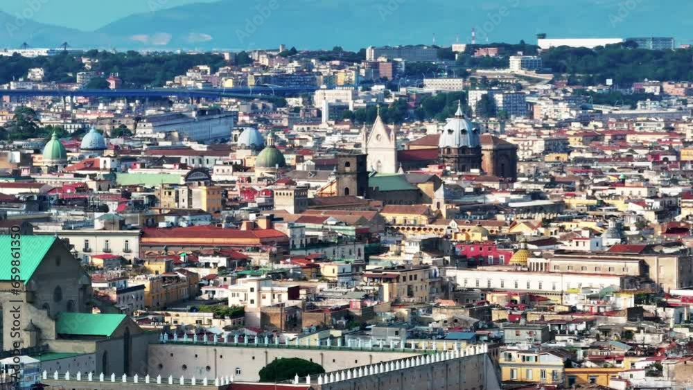 A view of Napoli, Italy, Aerial view of the historic center, panoramic drone view of the entire city of Italy. Flight over historical landmarks, narrow streets and buildings with colour rooftops A view of Napoli, Italy, Aerial view of the historic center, panoramic drone view of the entire city of Italy. Flight over historical landmarks, narrow streets and buildings with colour rooftops