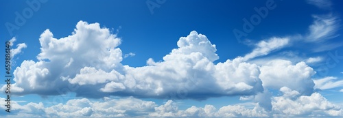 Natures canvas: serene panorama of blue sky and drifting white clouds