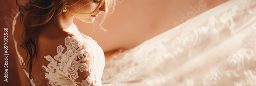 The bride's lace wedding gown is captured in close-up
