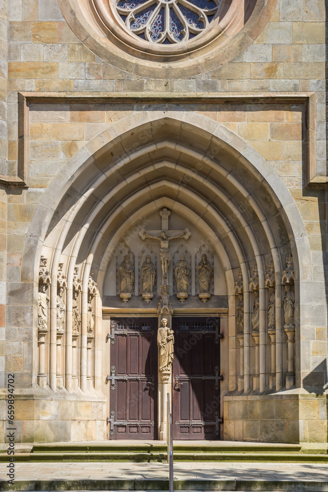 Entrance to the historic Sankt Vitus church in Meppen, Germany