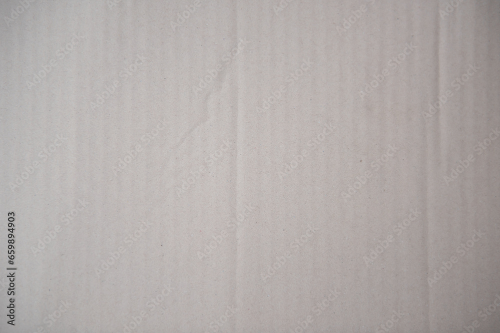 Cardboard surface from a paper box for packing,designs decoration.Old kraft paper box craft pattern. Cardboard surface from a paper box for packing,designs decoration.Old kraft paper box craft pattern.