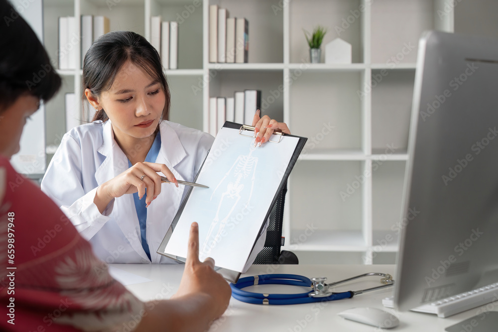 Medicine, healthcare and people concept female doctor with clipboard talking to man patient at hospital Medicine, healthcare and people concept female doctor with clipboard talking to man patient at hospital