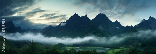 Verdant mountainscapes with a mystical fog nestled amid peaks and summits