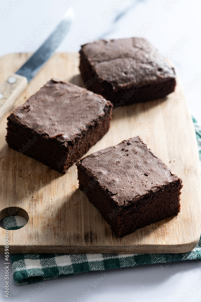 Chocolate brownie portions on marble background Chocolate brownie portions on marble background