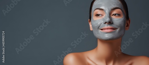 Woman getting facial treatment at salon With copyspace for text