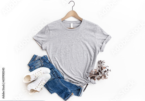 Gray womans cotton Tshirt mockup with eucalyptus , jeans, sneakers on white background. Design t shirt template, print presentation mock up. Athletic Heather Grey  Top view flat lay.