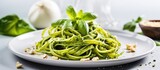 Traditional Italian pasta with pesto sauce made of pine nuts garlic basil Parmesan cheese olive oil served with tagliatelle Healthy and vegetarian With copyspace for text