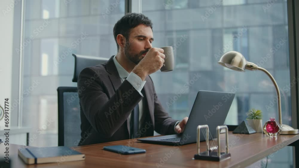 Busy manager enjoy coffee at office work on workplace close up. Man drinking Busy manager enjoy coffee at office work on workplace close up. Man drinking