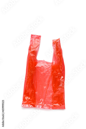 Top view wrinkled Red plastic bag isolated on white background, cut out object. Close up Single-use polythene packet, Cellophane bag for grocery, waste reduction, reusable materials, non-plastic