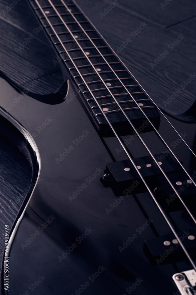 Obraz premium Electric bass and strings. Musical instrument background for poster design. Live concerts and lp covers and heavy rock music