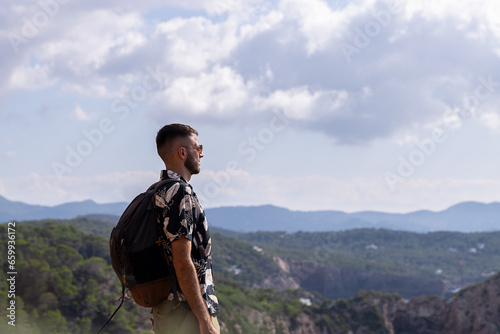 Caucasian man looking at the view from the mountain
