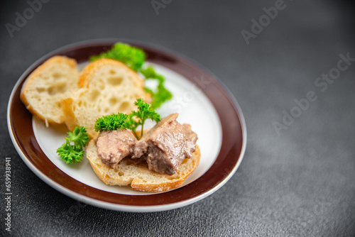 Cod liver delicious seafood appetizer meal food snack on the table copy space © Alesia Berlezova