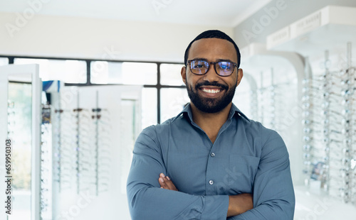 Eyeglasses, arms crossed and portrait of happy man, optician or ophthalmologist for vision help, healthcare or ophthalmology. Lens glasses, pride and professional African ophthalmologist for eye care